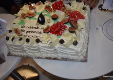 The new partnership was celebrated with a delicious looking cake.